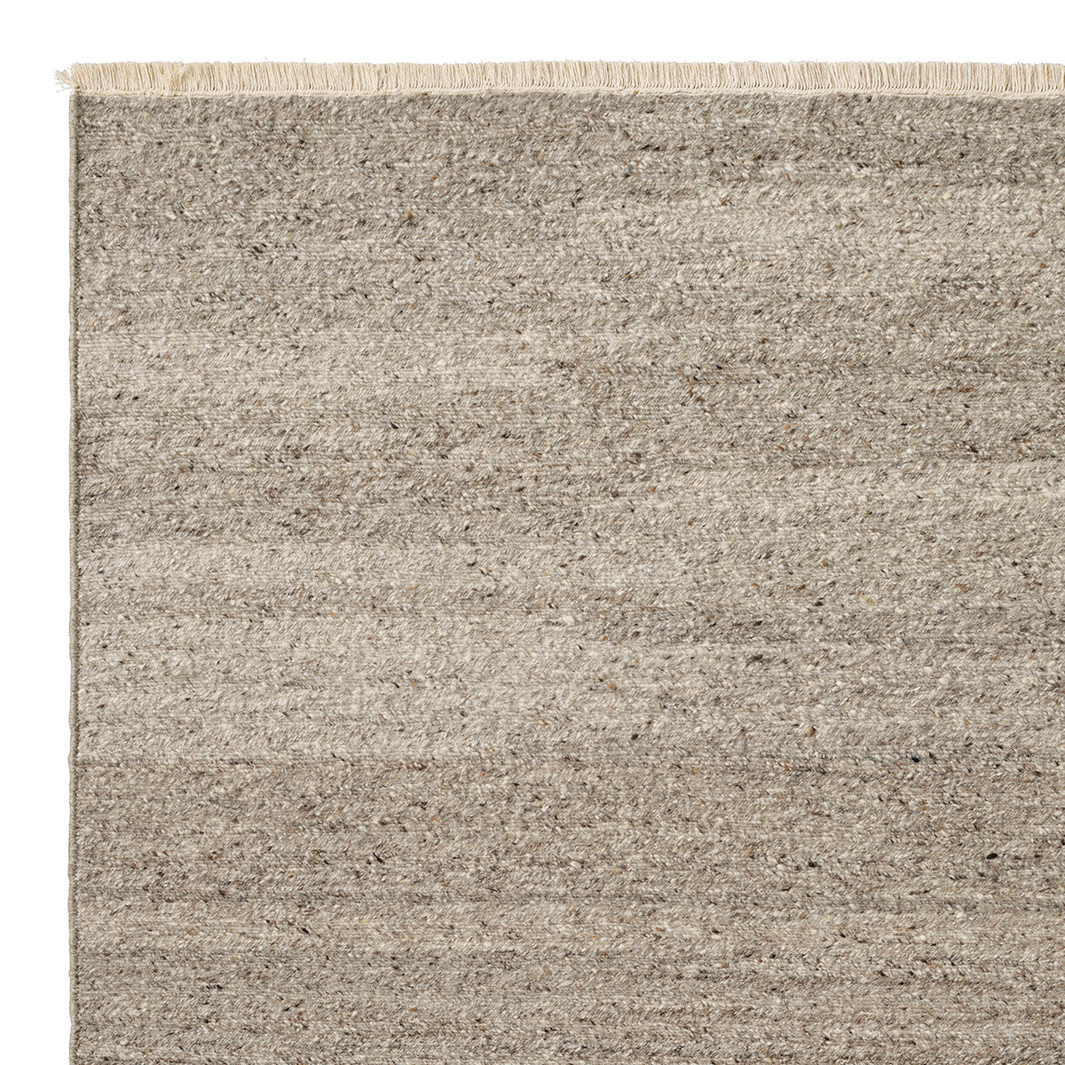 Cable Rug by Armadillo, handwoven from a luxurious mix of Italian and Argentinian wools, featuring a chevron pattern created through a traditional soumak weave, with fine cotton fringe edges, available in colors like Calico, Chambray, Seed, Jade, and Bisque, and sizes ranging from 1.7 x 2.4m to 3 x 4m.