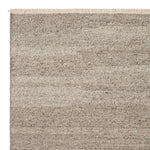 Cable Rug by Armadillo, handwoven from a luxurious mix of Italian and Argentinian wools, featuring a chevron pattern created through a traditional soumak weave, with fine cotton fringe edges, available in colors like Calico, Chambray, Seed, Jade, and Bisque, and sizes ranging from 1.7 x 2.4m to 3 x 4m.