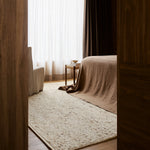 Faroe Rug by Armadillo, hand-knotted from undyed European wool using an Indo-Nepali technique, featuring a chunky weave reminiscent of cozy knitwear, available in the color Foal, offering a plush, textural pile that adds warmth and character to interiors.