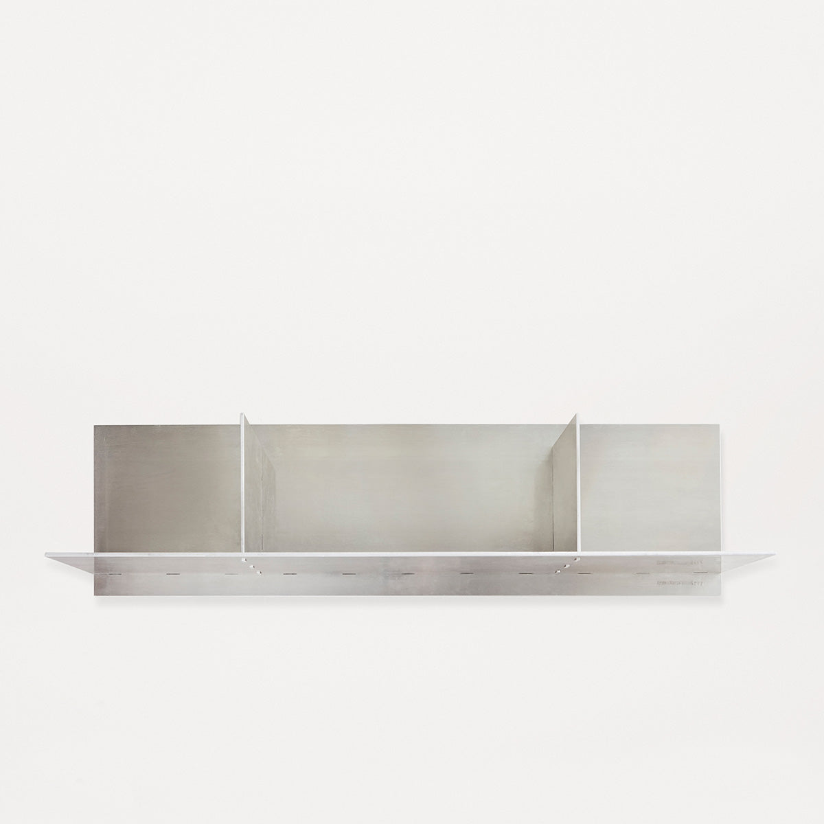 Frama Rivet Shelf by Jonas Trampedach, handcrafted from untreated aluminum using a traditional riveting technique, featuring a minimalist design with compartments for storage and display, suitable for both indoor and outdoor use.
