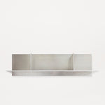 Frama Rivet Shelf by Jonas Trampedach, handcrafted from untreated aluminum using a traditional riveting technique, featuring a minimalist design with compartments for storage and display, suitable for both indoor and outdoor use.