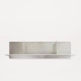 Frama Rivet Shelf by Jonas Trampedach, handcrafted from untreated aluminum using a traditional riveting technique, featuring a minimalist design with compartments for storage and display, suitable for both indoor and outdoor use.