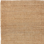 Nest vloerkleed van Armadillo, handgeweven van 100% natuurlijke jute met zorgvuldig afgewerkte uiteinden, verkrijgbaar in de kleuren Natural en Charcoal, biedt een minimalistisch ontwerp dat warmte en textuur toevoegt aan woonruimtes.