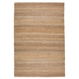 Nest vloerkleed van Armadillo, handgeweven van 100% natuurlijke jute met zorgvuldig afgewerkte uiteinden, verkrijgbaar in de kleuren Natural en Charcoal, biedt een minimalistisch ontwerp dat warmte en textuur toevoegt aan woonruimtes.