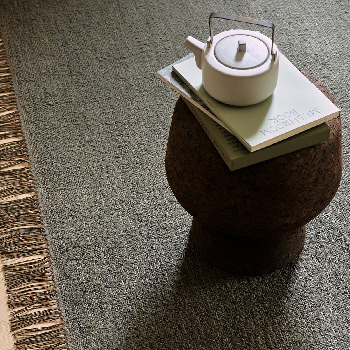 Willow Rug by Armadillo, handwoven with a linen warp and a wool-jute weft, available in earthy tones like mustard, cumin, cypress, and eggshell, offering a light, low-profile design that combines comfort and style.