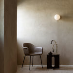 TR Bulb Wall Lamp by Audo Copenhagen – Designed by Tim Rundle, this minimalist wall lamp features a dimmable LED bulb encased in a hand-blown opal glass diffuser, mounted on a sleek metal bracket. Available in finishes such as matte black, polished steel, and brushed brass, providing soft, ambient lighting suitable for various interior styles.