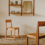 Two of Frama's chair 01 and the selfing system applied on the wall