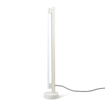 Eiffel Floor Lamp by Frama featuring a minimalist design with a stainless steel frame, opal glass LED tube, and a natural stone base, offering dimmable ambient lighting suitable for various interior settings.