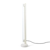 Eiffel Floor Lamp by Frama featuring a minimalist design with a stainless steel frame, opal glass LED tube, and a natural stone base, offering dimmable ambient lighting suitable for various interior settings.