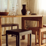 Frama low stool 01 with a table setting