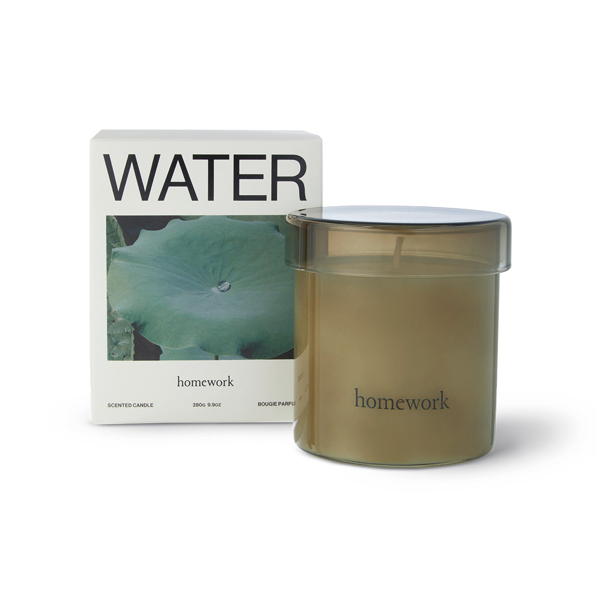 Homework Water Scented Candle – 180g – A 100% natural candle handcrafted in the UK, featuring a silky blend of rapeseed and coconut wax. Fragranced with responsibly-sourced essential oils, this candle offers a scent profile of citrus, water, wood, and spice. Housed in a warm-toned lidded glass jar that can be reused after the candle has burned down. Palm-free and vegan. Burn time: 35–40 hours.