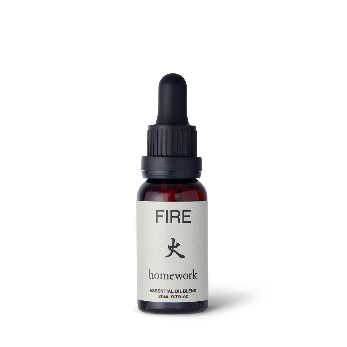 Homework Fire Essential Oil Blend – 20ml – A 100% natural, responsibly-sourced essential oil blend crafted in London, inspired by the warmth and passion of the Fire element. Features a scent profile of smoke, wood, spice, and citrus, with ingredients like cedarwood, sandalwood, camphor, patchouli, clove, coriander, orange, cade, and hibawood oils. Ideal for use in diffusers or oil burners to create a cozy and energizing atmosphere.