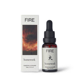 Homework Fire Essential Oil Blend – 20ml – A 100% natural, responsibly-sourced essential oil blend crafted in London, inspired by the warmth and passion of the Fire element. Features a scent profile of smoke, wood, spice, and citrus, with ingredients like cedarwood, sandalwood, camphor, patchouli, clove, coriander, orange, cade, and hibawood oils. Ideal for use in diffusers or oil burners to create a cozy and energizing atmosphere.