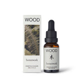 Homework Wood Essential Oil Blend – 20ml – A 100% natural essential oil blend handcrafted in London, inspired by the Wood element. Features a scent profile of wood, earth, moss, and green, crafted with ingredients like pine, cedarwood, camphor, patchouli, vetiver, clary sage, cypress, and hinoki oils. Ideal for use in diffusers or oil burners to create a calming and grounding atmosphere