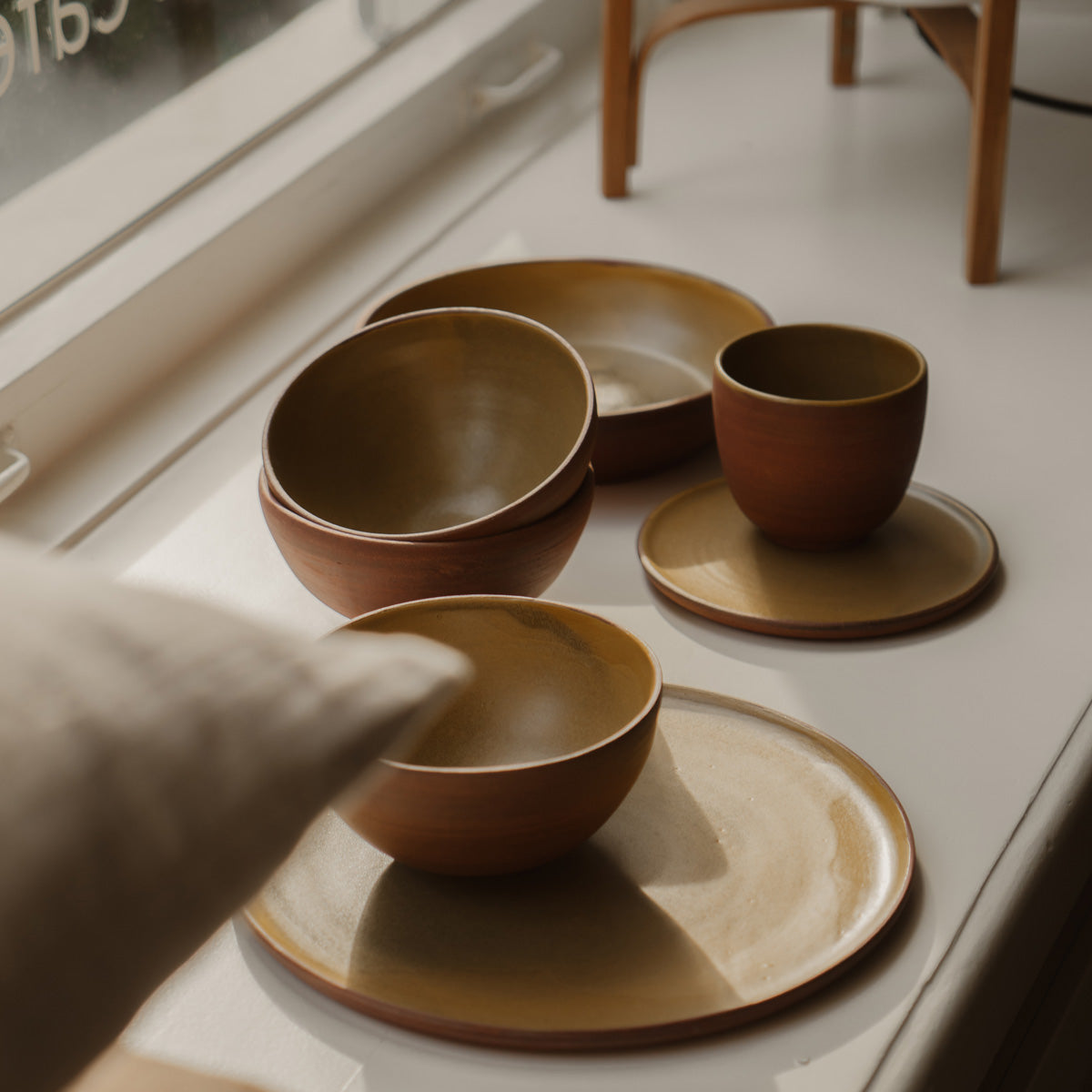 Handthrown Ceramic Cup by Carien Kuypers van Dongen, crafted from stoneware with a matte glaze made from pigments sourced from IJssel clay, available in espresso and cappuccino sizes, each piece uniquely handcrafted.