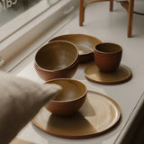 Handthrown Ceramic Cup by Carien Kuypers van Dongen, crafted from stoneware with a matte glaze made from pigments sourced from IJssel clay, available in espresso and cappuccino sizes, each piece uniquely handcrafted.