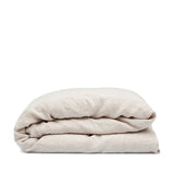 Linen duvet cover in Alabaster by By Mölle – 100% pre-washed European linen with a chambray weave of creamy beige and off-white yarns, featuring a soft, neutral shade with pale pink undertones, available in various sizes and closure options.
