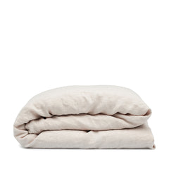 Linen duvet cover in Alabaster by By Mölle – 100% pre-washed European linen with a chambray weave of creamy beige and off-white yarns, featuring a soft, neutral shade with pale pink undertones, available in various sizes and closure options.