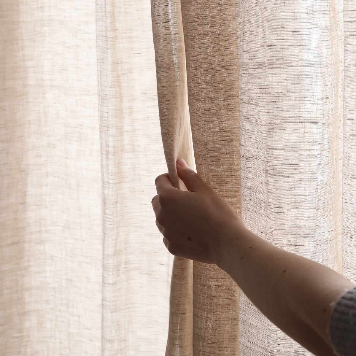 By Mölle's Sheer Linen Curtain 110 gr/m², crafted from open-weave linen woven in Italy, offers a soft, translucent texture that beautifully diffuses light. The fabric's width of 320 cm allows for seamless panels, enhancing the natural ambiance of your space. Available in seven subtle shades, this curtain can be customized with single pleats, wave pleats, or a rod pocket. Pre-washed for a soft touch and nice drape, it brings a timeless, natural look to any room.