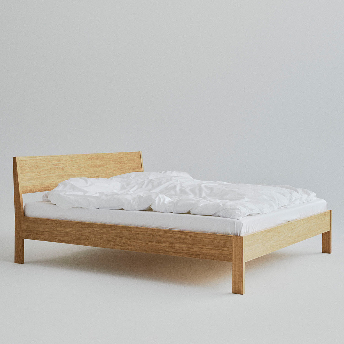 Ejer Bed Frame by RYE available in oiled oak, black stained oak, or smoked oak finishes, featuring a minimalist design with clean lines and a slightly inclined headboard, crafted for a tranquil and restful sleep environment