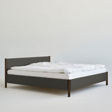 Veng Bed Frame by RYE featuring a minimalist design with a linen-upholstered frame and solid oak wood posts, embodying Scandinavian craftsmanship and timeless elegance.