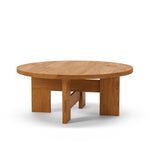 Mio Coffee Table by Thorup Copenhagen featuring a minimalist design with a solid oak frame and a round travertine tabletop, showcasing Scandinavian craftsmanship and natural materials