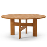 Mio Dining Table by Thorup Copenhagen featuring a minimalist round design crafted from FSC-certified solid oak, available in oiled or stained finishes, with distinctive steel fasteners and an organic silhouette