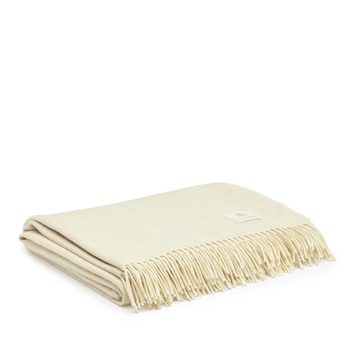 Lambswool Throw in Cream by By Mölle – 100% Merino lambswool woven in a classic herringbone pattern, showcasing the natural cream shade of the wool. Measuring 140 x 200 cm, this lightweight yet warm throw is crafted in Europe and machine washable on a wool program. Ideal for adding a cozy touch to your living space.