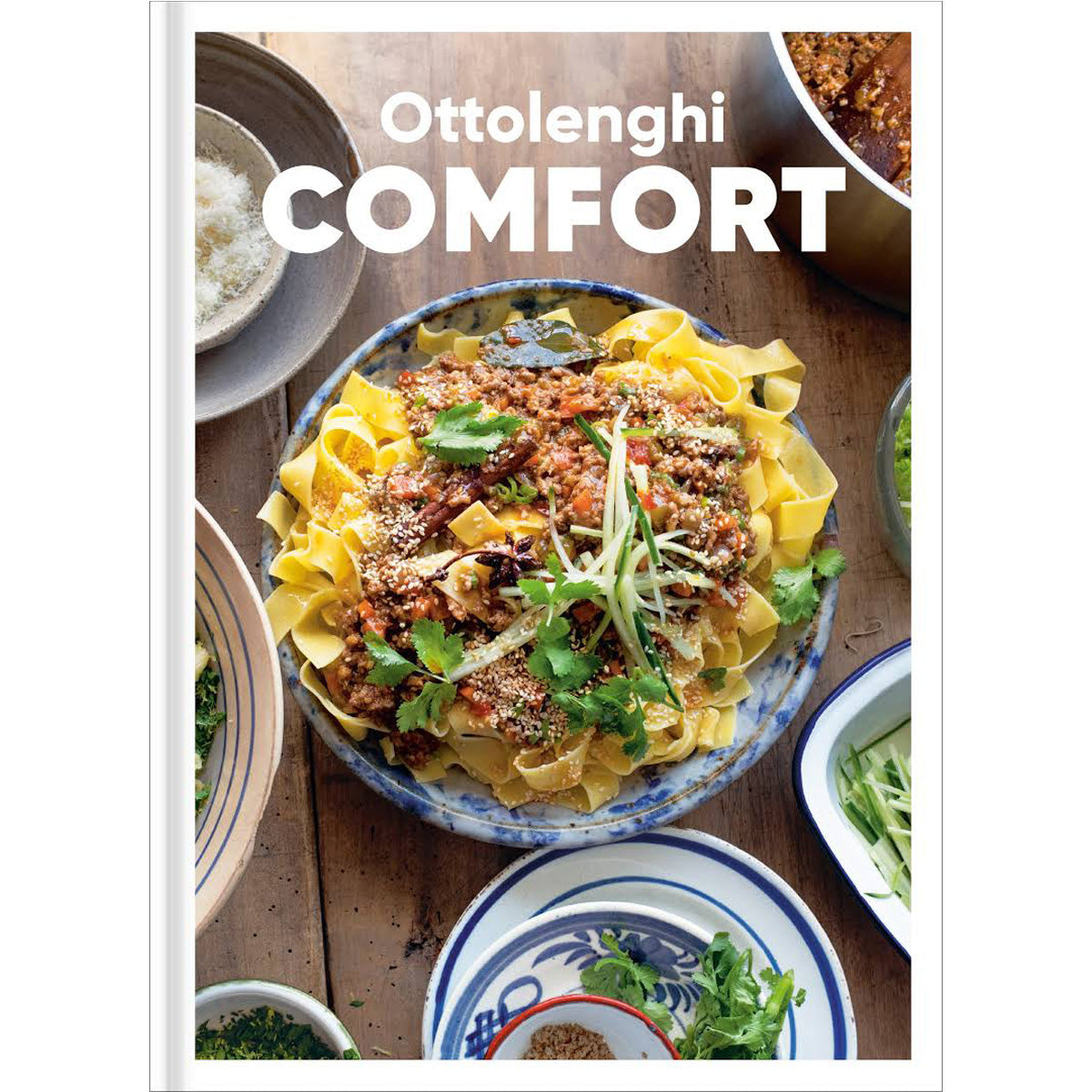 Cover of 'Ottolenghi Comfort' cookbook featuring a minimalist design with the title in bold typography, showcasing Yotam Ottolenghi's collection of comforting recipes