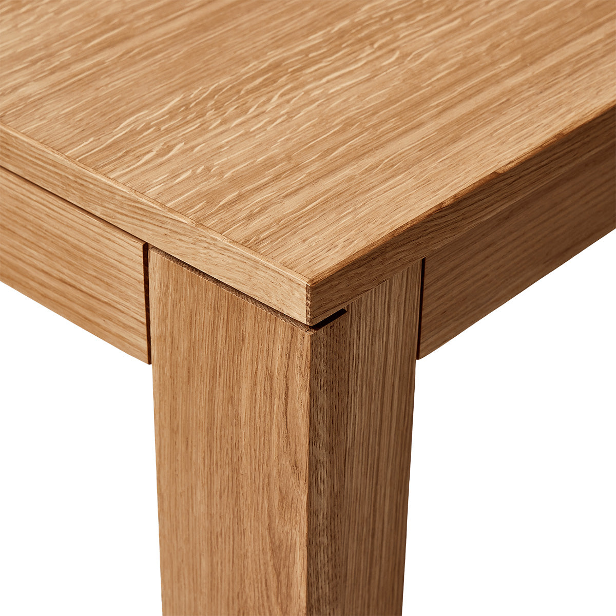 Square table with ultra-slim tabletop and recessed legs made of solid oak. A subtle shadow line between the top and frame creates a light floating effect. Modular design allows multiple tables to connect seamlessly in a row. Durable and elegant, ideal for everyday use in contemporary interiors.