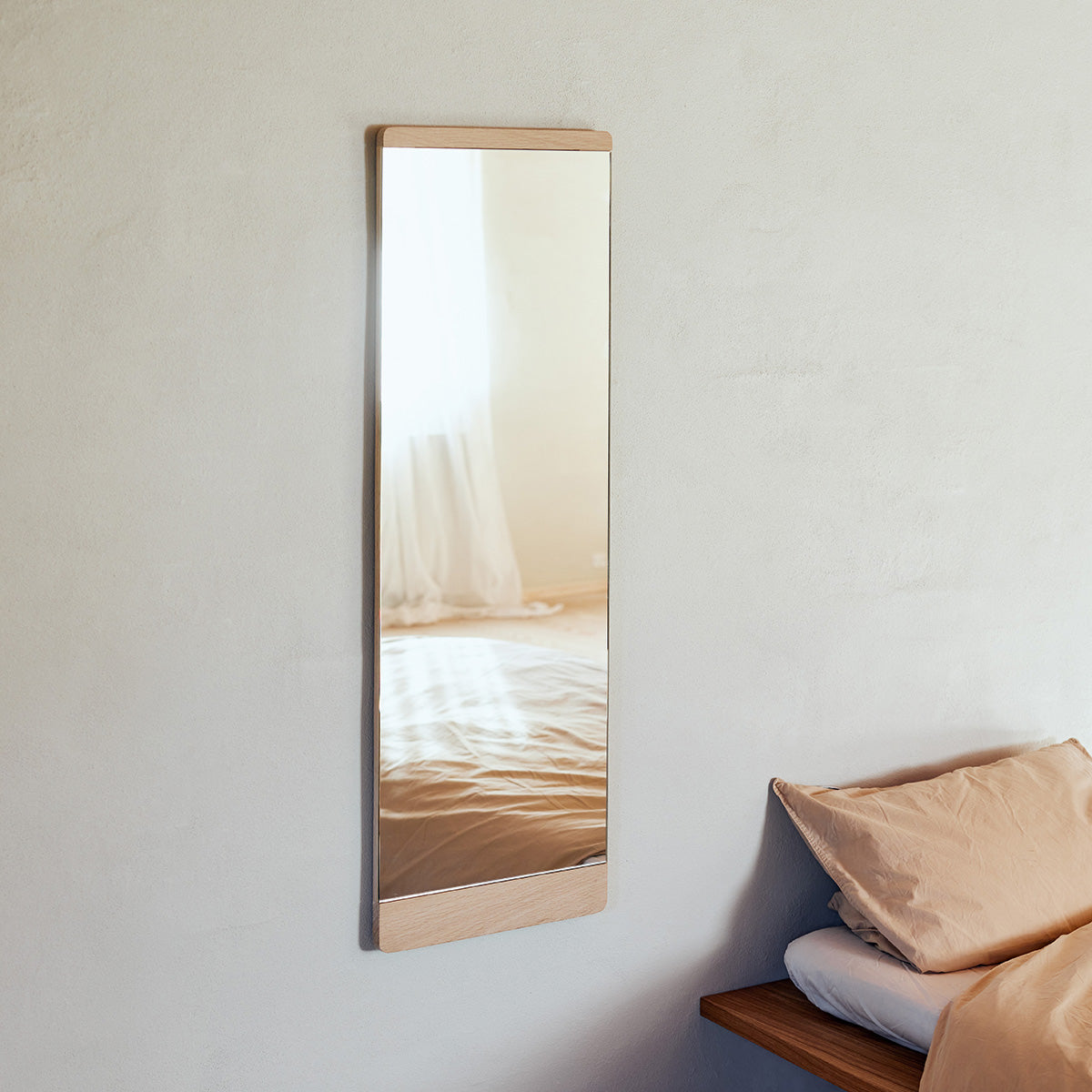 Minimalist wall mirror with a slim solid oak frame and elegant infinity glass finish. Timeless design, perfect for hallway, bedroom or bathroom.