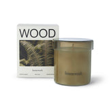 Homework Wood Scented Candle – 180g – A 100% natural candle handcrafted in the UK, featuring a silky blend of rapeseed and coconut wax. Fragranced with 100% responsibly-sourced natural essential oils, this candle offers a scent profile of wood, earth, moss, and green. Housed in a warm-toned lidded glass jar that can be reused after the candle has burned down. Palm-free and vegan. Burn time: 35–40 hours.