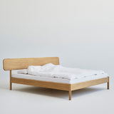 Alken bed frame in solid oak with Scandinavian design, handcrafted from sustainably sourced wood.