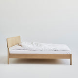 Alken bed frame in solid oak with Scandinavian design, handcrafted from sustainably sourced wood.