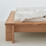 Hem bed frame in solid red oak with Scandinavian design, handcrafted in Denmark