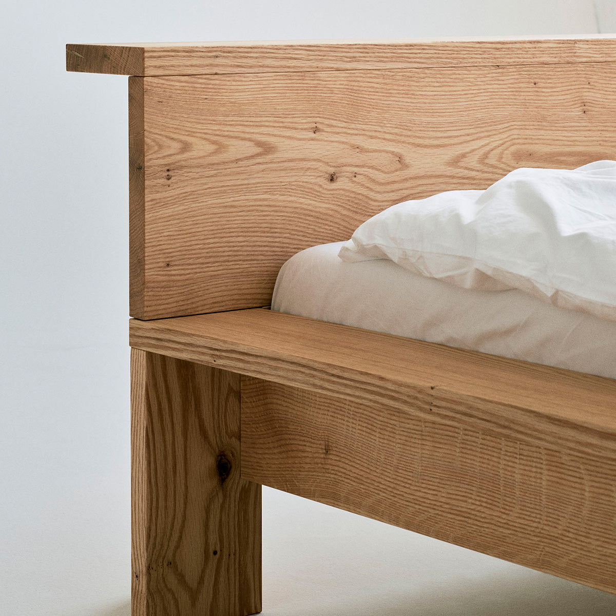 Hem bed frame in solid red oak with Scandinavian design, handcrafted in Denmark