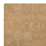 Detail van de handgecoilde jute structuur en gevlochten rand van het Sequoia vloerkleed