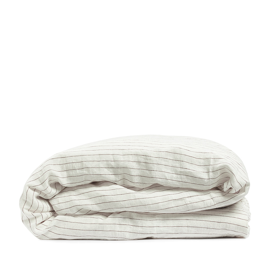 By Mölle's Cocoa Stripe linen duvet cover, crafted from 100% pre-washed European flax linen, features a warm white base with subtle cocoa-colored stripes. The chambray weave adds depth and character, offering a breathable and hypoallergenic fabric suitable for year-round comfort. Available with either wooden buttons or a full-width tuck-in flap closure.