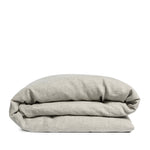 By Mölle's Flax linen duvet cover, crafted from 100% pre-washed European flax linen, features a natural, earthy tone achieved through chambray weaving with flax and off-white yarns. This breathable and hypoallergenic fabric offers comfort year-round and is available with either wooden buttons or a full-width tuck-in flap closure. Handmade in the Netherlands with respect for the earth.