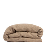 By Mölle's Hazel linen duvet cover, crafted from 100% pre-washed European flax linen. This warm, earthy tone adds a natural touch to your bedroom. The duvet cover is available with either wooden buttons or a tuck-in flap closure, combining functionality with timeless design.
