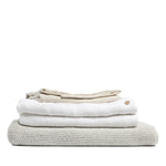 By Mölle's Pure White linen duvet cover, crafted from 100% pre-washed European flax linen, offers a crisp and fresh aesthetic. This breathable and hypoallergenic fabric provides comfort year-round and is available with either wooden buttons or a full-width tuck-in flap closure. Handmade in the Netherlands with respect for the earth.