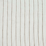 By Mölle's Cocoa Stripe linen, crafted from 100% pre-washed European flax linen, features a warm white base with subtle cocoa-colored stripes. The chambray weave adds depth and character, offering a breathable and hypoallergenic fabric suitable for year-round comfort.