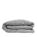 By Mölle's Pebble linen duvet cover, crafted from 100% pre-washed European flax linen, features a soft, contemporary grey shade achieved through chambray weaving with grey and off-white yarns. This breathable and hypoallergenic fabric offers comfort year-round and is available with either wooden buttons or a full-width tuck-in flap closure. Handmade in the Netherlands with respect for the earth.