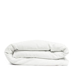 By Mölle's Pure White linen duvet cover, crafted from 100% pre-washed European flax linen, offers a crisp and fresh aesthetic. This breathable and hypoallergenic fabric provides comfort year-round and is available with either wooden buttons or a full-width tuck-in flap closure. Handmade in the Netherlands with respect for the earth.