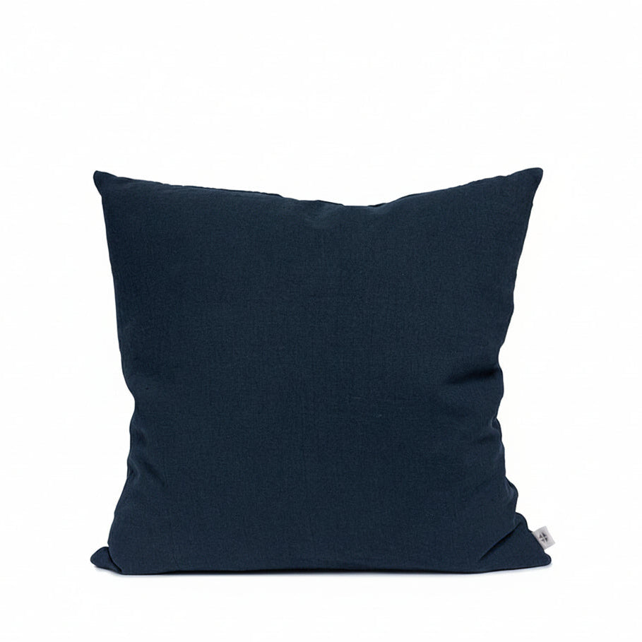 Navy blue pillow on a white background