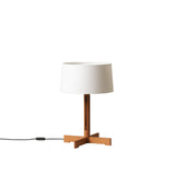 Table lamp with a white shade and wooden base on a white background