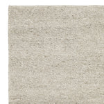 Close-up van de textuur van het Aspen vloerkleed met lineaire soumak-weving