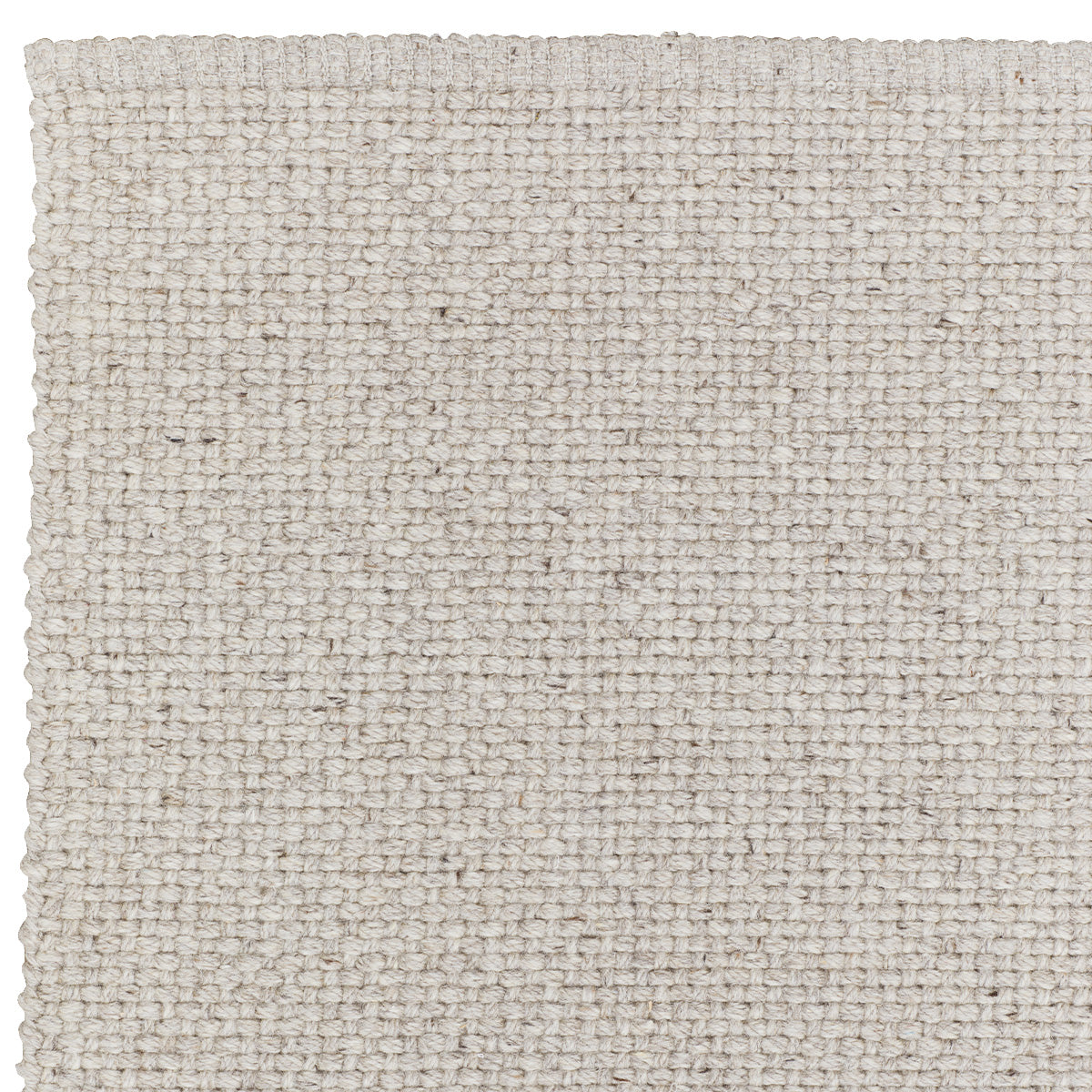 Detail of cross-hatched texture in the natural wool Winnow rug – durable and artisan-made