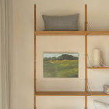 Wooden shelf against a wall with decorative items including a painting and pillows.