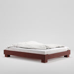Houten bedframe Cubico van RYE, in de kleur dark amber.